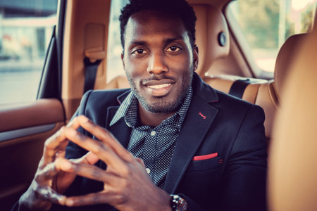 Casual afro american male in a car.