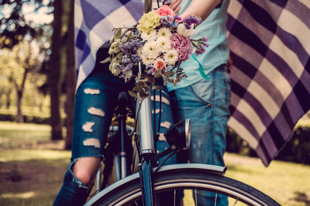 Colorful flowers bouquet on bicycle handlebar.の写真素材