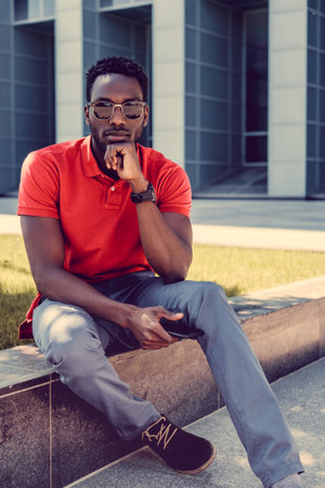 Portrait of serious black man in a red t shirt.の写真素材