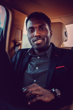 Smiling black man in a car.の写真素材
