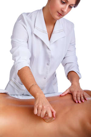 Female enjoing relaxing back massage in cosmetology spa centre.の写真素材