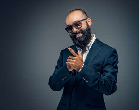 Studio portrait of bearded male in a business suit.の写真素材