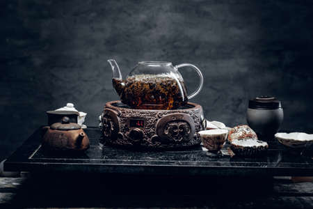 Traditional herbal tea in transparent glass teapot.の写真素材