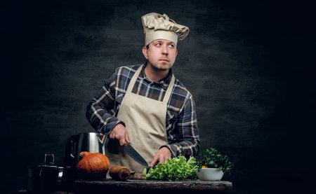 Studio portrait of male chefpreparing healthy salad.