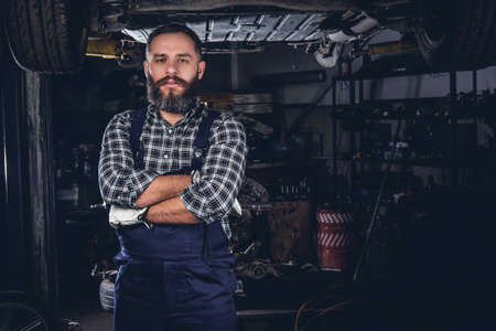 Portrait of bearded mechanical male in a garage.の写真素材