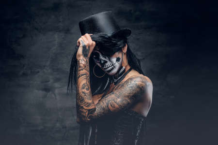 Portrait of zombie woman with painted skull face.の写真素材