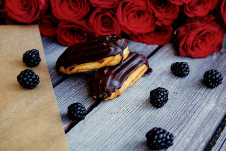 Delicious chocolate eclair on a table.