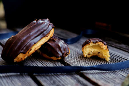 Delicious chocolate eclair on a table.の写真素材