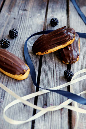 Delicious chocolate eclair on a table.