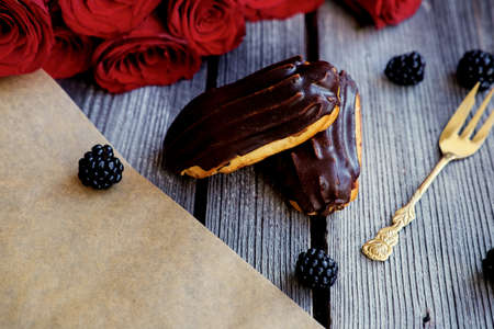 Delicious chocolate eclair on a table.