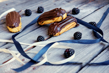 Delicious chocolate eclair on a table.