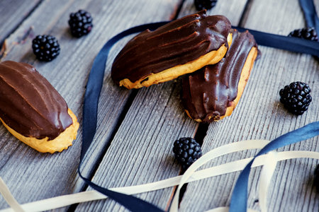 Delicious chocolate eclair on a table.