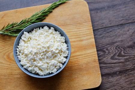 Delicious curd with herbs in a cup.
