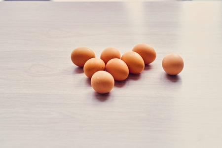 Brown chicken eggs on a table.