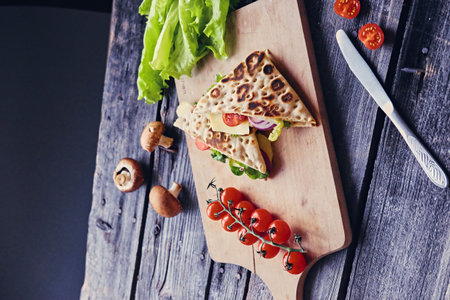 Delicious pita bread with ham, cucumber and tomatoes.