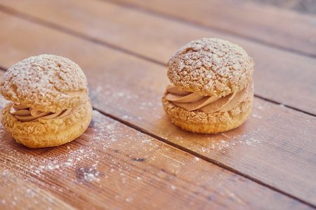 Baked sweet cakes on a wooden table.