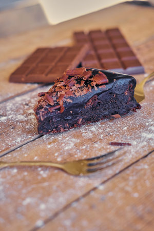 Bitter chocolate bar on a wooden table.