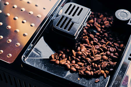 Roasted coffee beans in a coffee machine.の写真素材