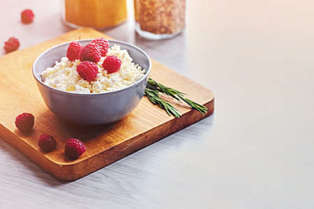 Diet curd with raspberry in a cup.の写真素材