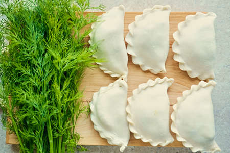 Making Russian dumplings with parsley.の写真素材