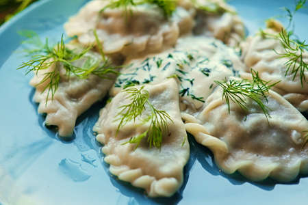 Delicious dumplings with parsley in a pot.の写真素材