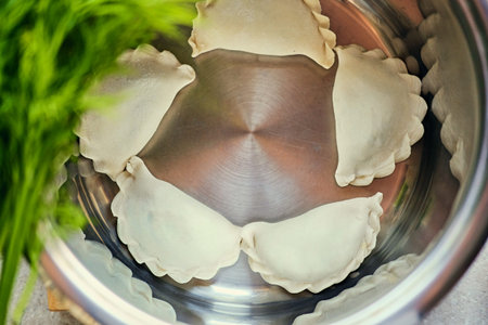 Making Russian dumplings with parsley.