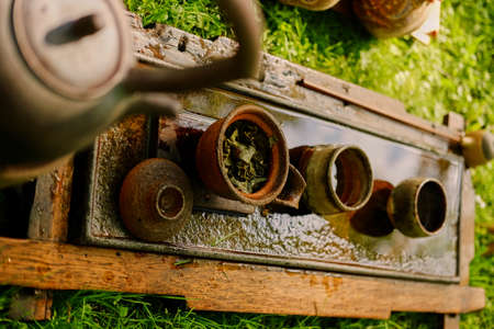 Chinese tea ceremony in a park.の写真素材
