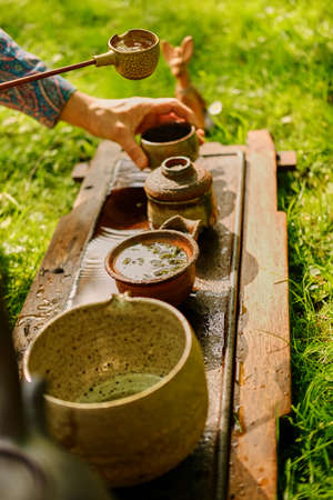 Chinese tea ceremony in a park.の写真素材