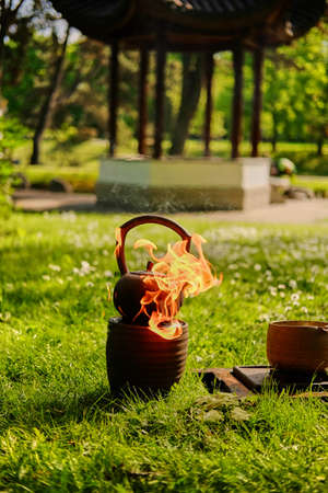 Chinese tea ceremony in a park.の写真素材