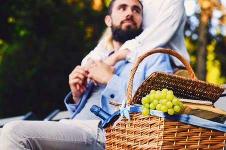 Happy modern couple on a date make a picnic in a city.の写真素材