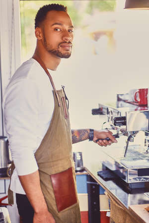 Portrait of Black barista male.の写真素材