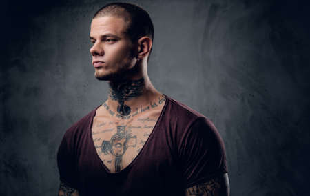 Close up portrait of a man with tattoo on his neck.の写真素材