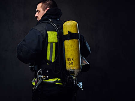 Firefighter with an oxygen tank on his back.の写真素材