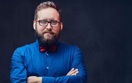 A man in eyeglasses and bow tie.