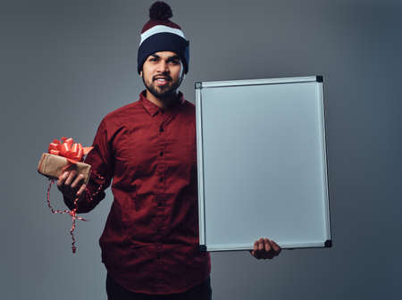 A man holds white empty desk for commercial text here.の写真素材