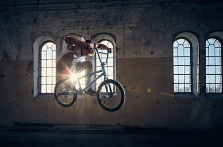 The BMX rider jumps with a bicycle.の写真素材