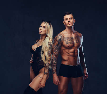 Beautiful couple, posing in studio.の写真素材