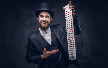 Magician showing trick with playing cards.の写真素材