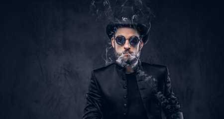 Magician showing trick with playing cards.