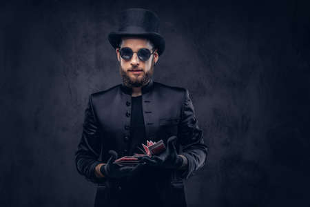 Magician showing trick with playing cards.の写真素材