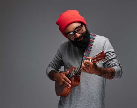 Portrait of a bearded male isolated on grey background.の写真素材