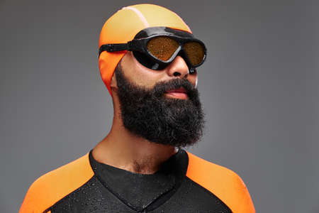 Portrait of a bearded male isolated on grey background.の写真素材