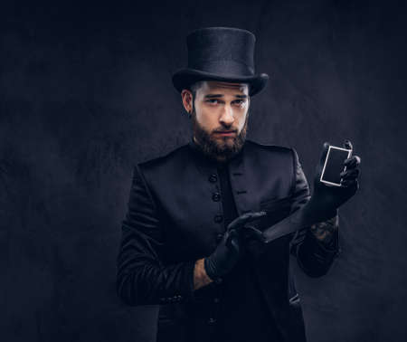 Magician showing trick with playing cards.の写真素材