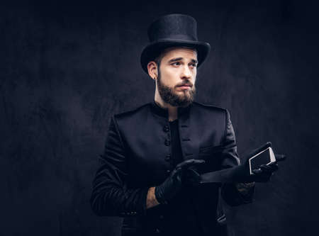 Magician showing trick with playing cards.の写真素材