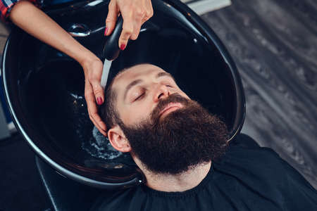 Handsome bearded man in the barbershop.の写真素材