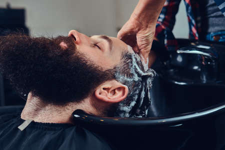 Handsome bearded man in the barbershop.の写真素材