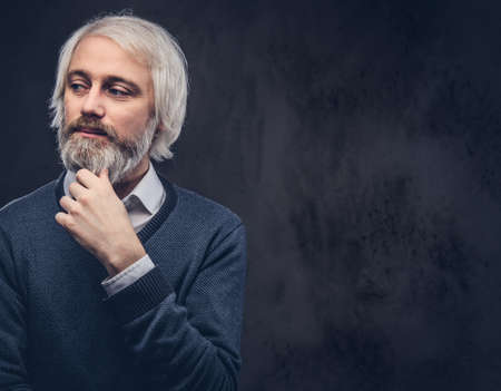 Portrait of an old man with a gray beard.の写真素材