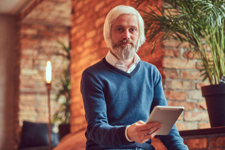 Portrait of an old man with a gray beard.の写真素材