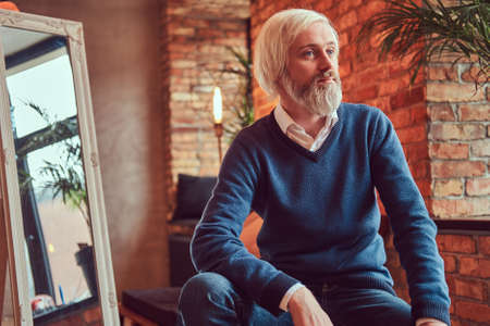 Portrait of an old man with a gray beard.の写真素材