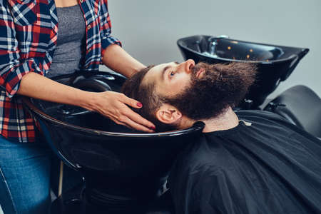 Handsome bearded man in the barbershop.の写真素材